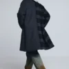 Vlněný kabát z dvou materiálů s kostkovaným vzorem